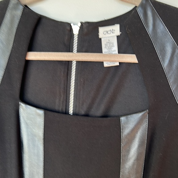 New Cache black stylish below the knee dress. Leather accents,zipper down back. - Picture 4 of 7